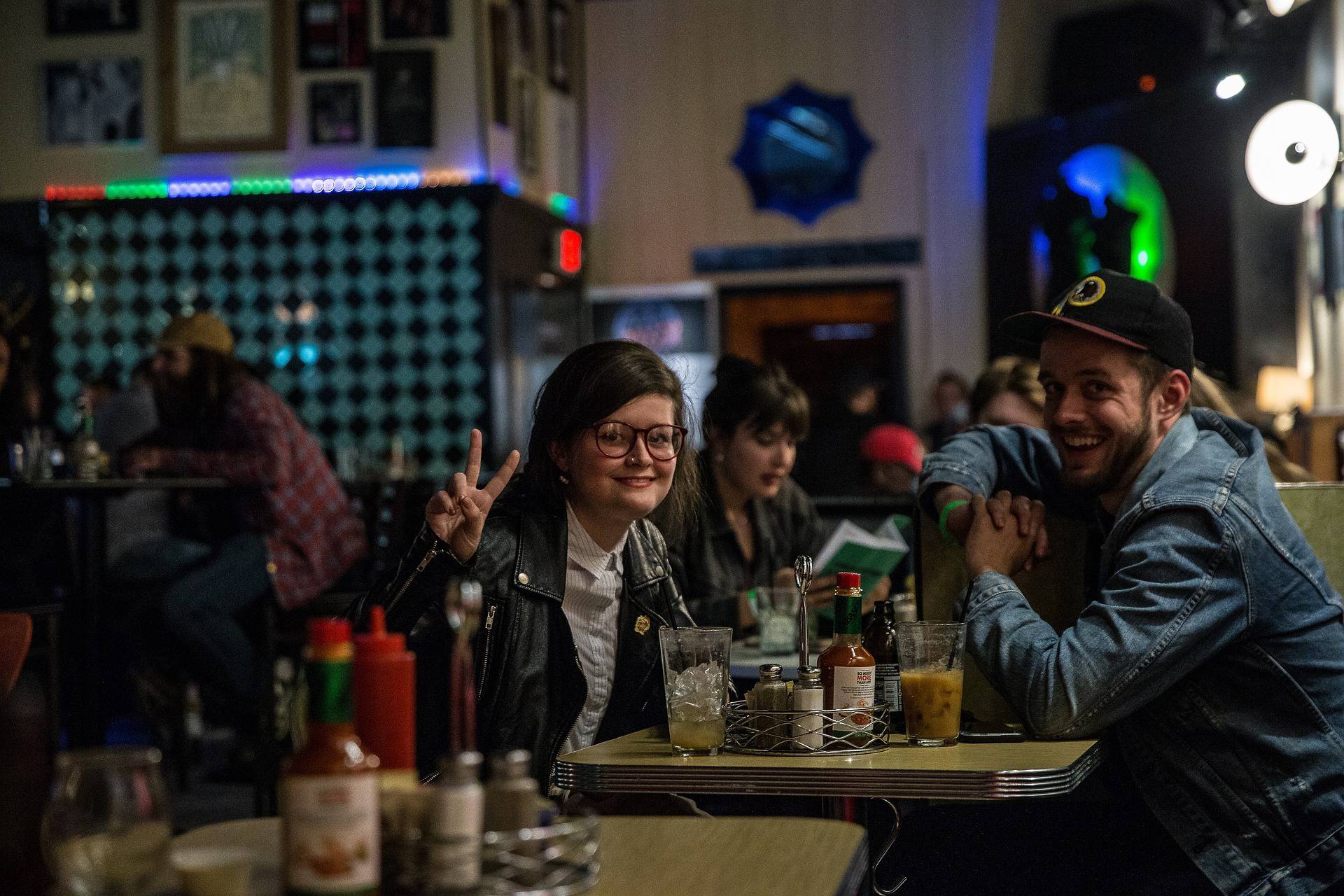 a group of people in a lively bar setting